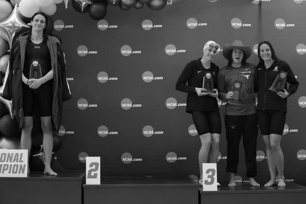 Lia Thomas, left, of the University of Pennsylvania stands on the podium after winning the 500-yard freestyle as other medalists Emma Weyant, Erica Sullivan and Brooke Forde pose for a photo, March 17, 2022, in Atlanta. (Photo: Justin Casterline via Getty Images)