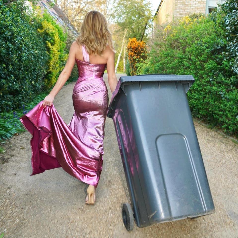 Amanda Holden taking out the bins in a purple couture dress