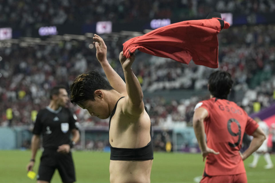 South Korea's Hwang Hee-chan celebrates after scoring his side's 2nd goal during the World Cup group H soccer match between South Korea and Portugal, at the Education City Stadium in Al Rayyan , Qatar, Friday, Dec. 2, 2022. (AP Photo/Hassan Ammar)