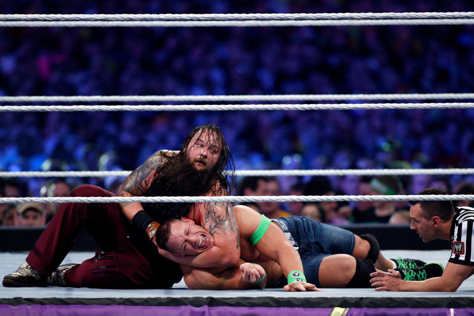 John Cena, right, and Bray Wyatt, left, compete during Wrestlemania XXX at the Mercedes-Benz Super Dome in New Orleans on Sunday, April 6, 2014. (Jonathan Bachman/AP Images for WWE)