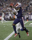 FILE - In this Oct. 4, 2018, file photo, New England Patriots wide receiver Josh Gordon, left, catches a touchdown pass in front of an Indianapolis Colts defender during the second half of an NFL football game, in Foxborough, Mass. Patriots receiver Josh Gordon says he is stepping away from football in order to focus on his mental health. In a statement posted on Twitter on Thursday morning, Dec. 20, 2018, Gordon said his decision was spurred by him feeling recently that he could have a better grasp on things mentally. He thanked the Patriots for their support and vowed to work his way back. (AP Photo/Charles Krupa, File)