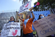 Anti-abortion activists demonstrate outside the National Assembly as lawmakers vote on whether to allow abortion in all cases of rape, in Quito, Ecuador, Thursday, Feb. 17, 2022. Currently, abortion is legal in Ecuador if the mother’s life is in danger or in cases involving the rape of a woman with a mental disability. (AP Photo/Dolores Ochoa)