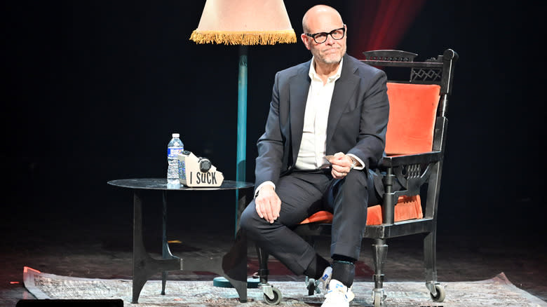 Alton Brown sitting onstage