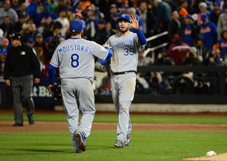 Kansas City Royals first baseman Eric Hosmer (35) celebrates with third baseman Mike Moustakas (8) after defeating the New York Mets in game four of the World Series at Citi Field. Jeff Curry-USA TODAY Sports