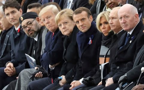 Canadian Prime Minister Justin Trudeau, Morocco's Prince Moulay Hassan, Moroccan King Mohammed VI, US First Lady Melania Trump, US President Donald Trump, German Chancellor Angela Merkel, French President Emmanuel Macron and his wife Brigitte Macron, Russian President Vladimir Putin and Australian Governor-General Peter Cosgrove attend a ceremony the Arc de Triomphe in Paris - Credit: AFP POOL