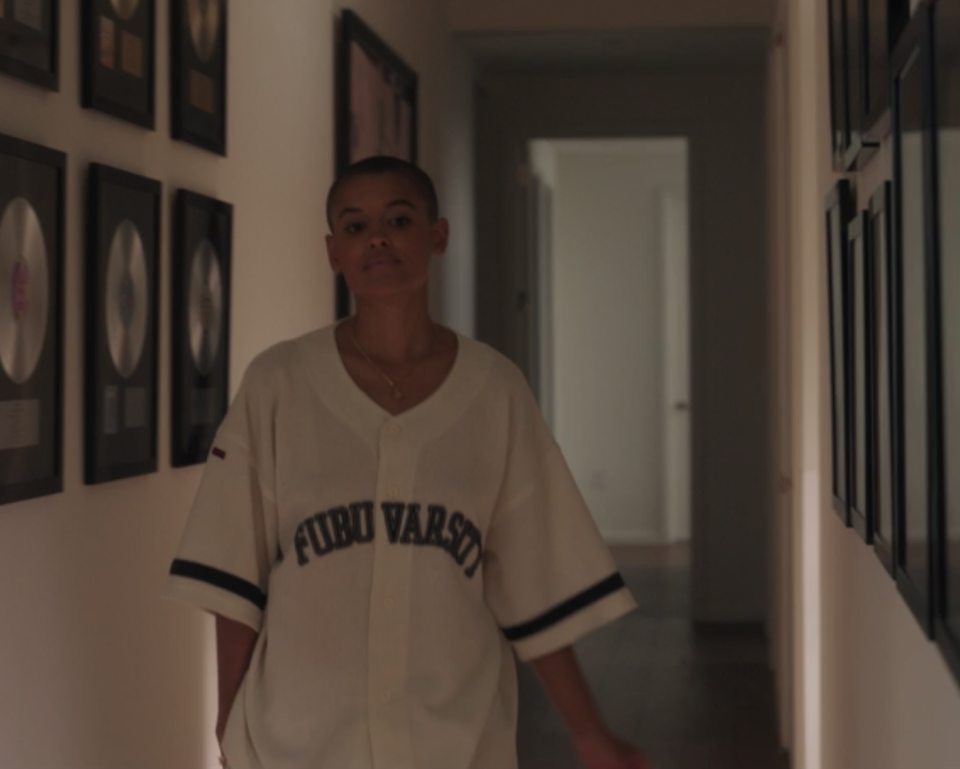 Julien Calloway wears an oversized baseball jersey