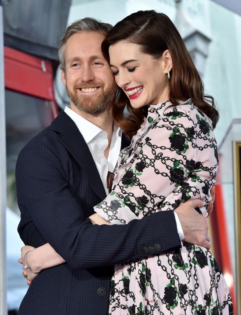 Adam Schulman and Anne Hathaway