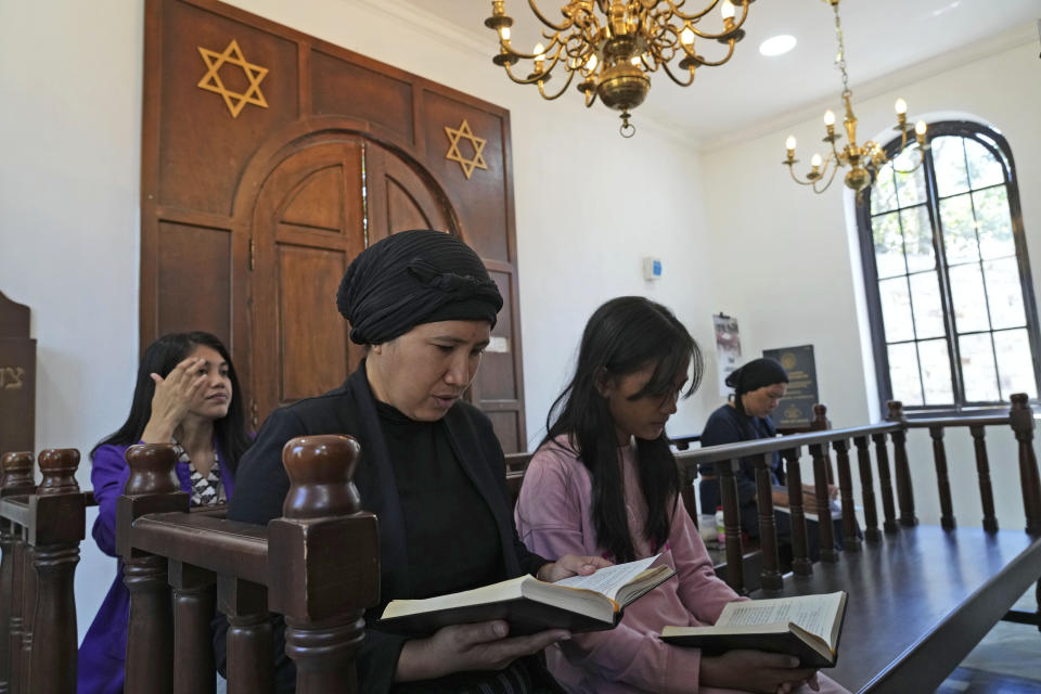 Indonesian Jews pray at Shaar Hashamayim Synagogue in Tondano, North Sulawesi, Indonesia, Saturday, Oct. 14, 2023. An Indonesian rabbi at the only synagogue in the world's most populous Muslim-majority nation, called on Saturday for peace and an an end to the fightings in Israel and Gaza. (AP Photo/Tatan Syuflana)