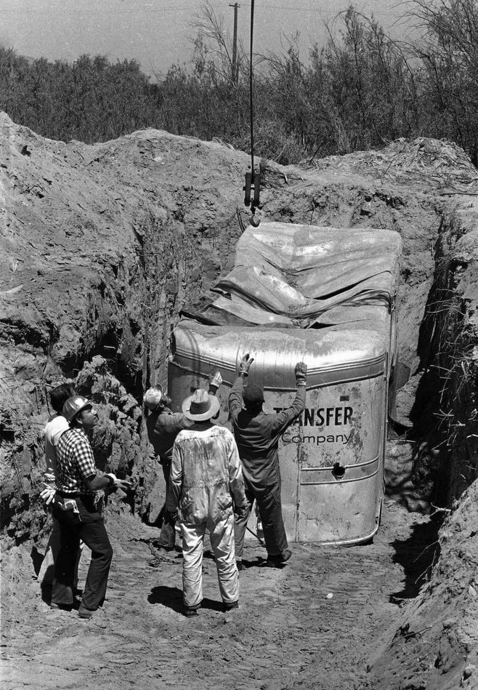 In this July 20, 1976, file photo, workmen get ready to remove a van from a rock quarry in Livermore in which 26 Chowchilla children and a bus driver were held captive.