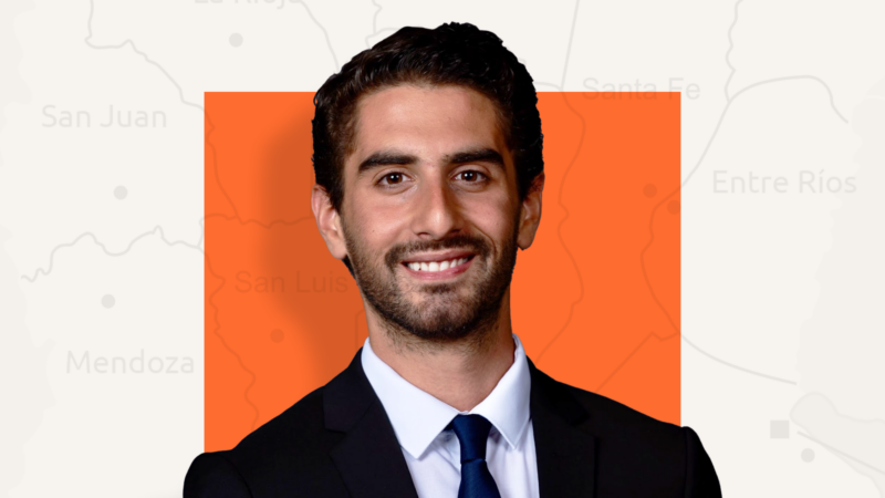 Marcus Falcone in front of orange square background