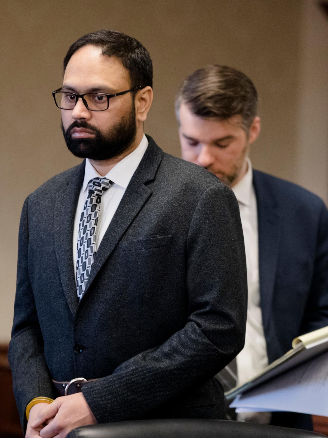 Gurpreet Singh, accused of shooting and killing his wife, and three in-laws in April 2019, walks into court to be arraigned with an interpreter in Judge Gregory J. Howard's Butler County courtroom in December 2019.
(Photo: Albert Cesare/The Enquirer)