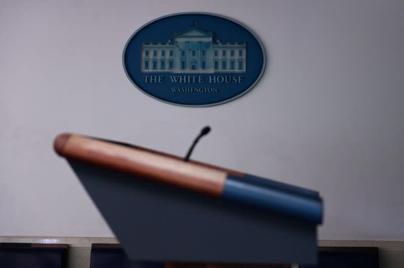 FILE PHOTO: The White House briefing room podium is dark and empty after the coronavirus task force did not hold a briefing for the second day in a row in Washington