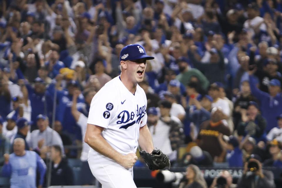 Dodgers relief pitcher Evan Phillips reacts after San Diego Padres Wil Myers hits a ground ball into a double play.