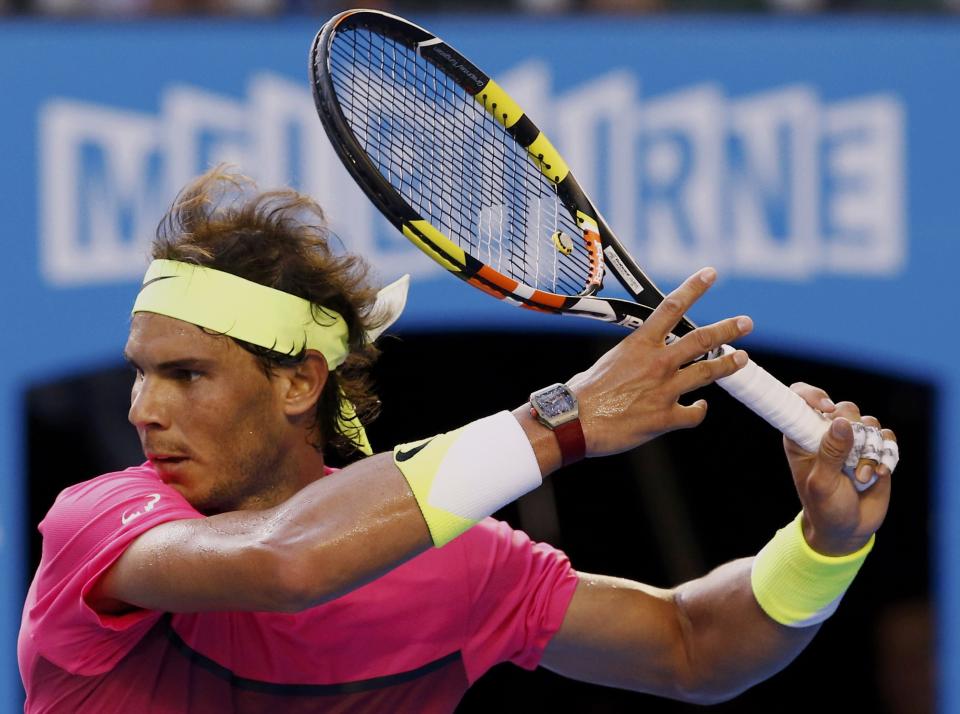 Rafael Nadal of Spain prepares to hit a return to Tim Smyczek of the U.S. during their men's singles second round match at the Australian Open 2015 tennis tournament in Melbourne January 21, 2015. REUTERS/Thomas Peter (AUSTRALIA - Tags: SPORT TENNIS)