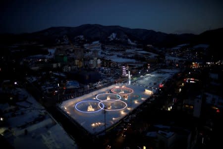 FILE PHOTO: An ice sculpture of the Olympic rings is illuminated during the Pyeongchang Winter Festival, near the venue for the opening and closing ceremony of the PyeongChang 2018 Winter Olympic Games in Pyeongchang, South Korea, February 10, 2017.  REUTERS/Kim Hong-Ji/File Photo