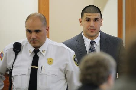 Former New England Patriots football player Aaron Hernandez arrives in the courtroom at Bristol County Superior Court in Fall River, Massachusetts April 1, 2015. REUTERS/Brian Snyder