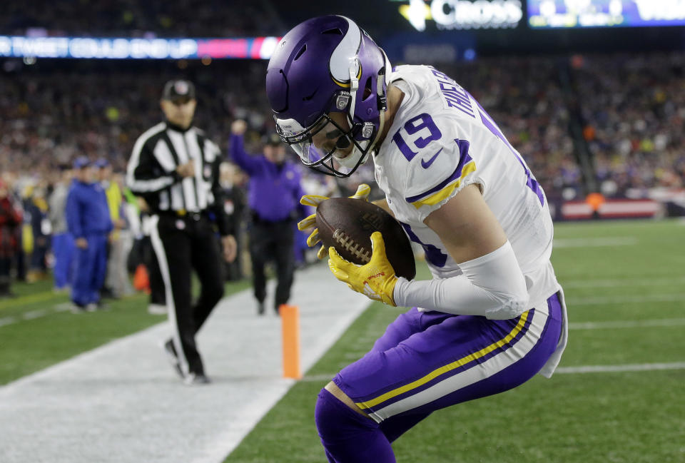 Minnesota Vikings wide receiver Adam Thielen catches a touchdown pass against the New England Patriots during the first half of an NFL football game, Sunday, Dec. 2, 2018, in Foxborough, Mass. (AP Photo/Steven Senne)