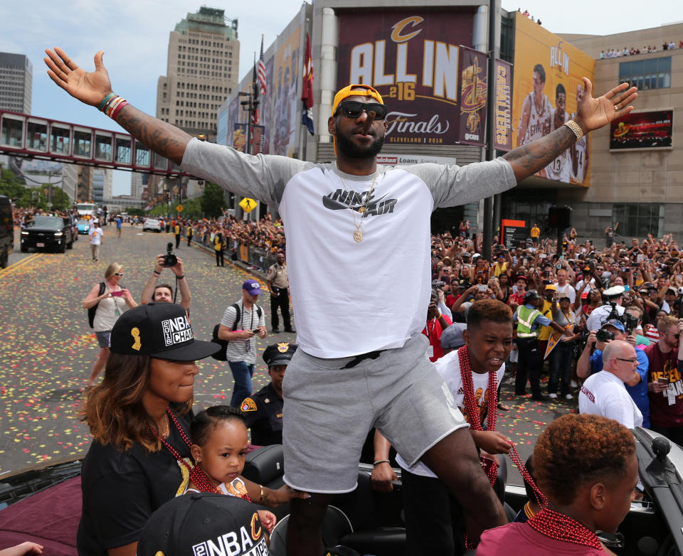 Cleveland Cavaliers Lebron James celebrates with the crowd during a parade to celebrate winning the 2016 NBA Championship in downtown Cleveland, Ohio, U.S. June 22, 2016. REUTERS/Aaron Josefczyk