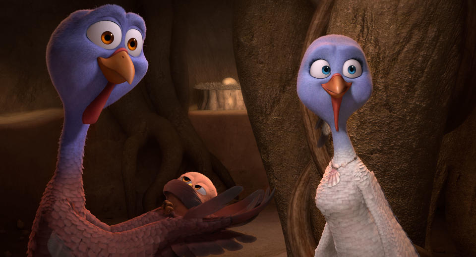 This image released by Relativity Media shows Jenny, voiced by Amy Poehler, right, and Reggie, voiced by Owen Wilson, left, in a scene from the animated film "Free Birds." (AP Photo/Relativity Media)