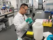 PeptiDream researcher Takayuki Nagasawa prepares a target protein for use in the company’s Peptide Discovery Platform System at the company's laboratory in Kawasaki, Japan