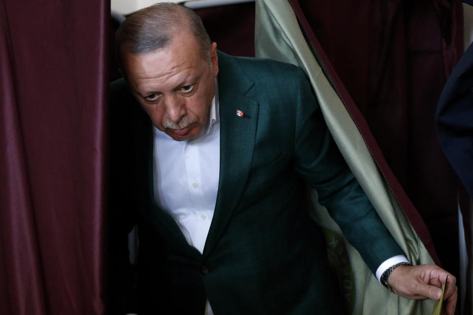 Turkey's President Recep Tayyip Erdogan, leaves the polling booth during local elections, in Istanbul, Sunday, March 31, 2019. Mayoral elections are underway in 30 large cities in Turkey along with other municipal races Sunday that are seen as a barometer of President Recep Tayyip Erdogan's popularity amid a sharp economic downturn in the nation straddling Europe and Asia. (AP Photo/Lefteris Pitarakis)