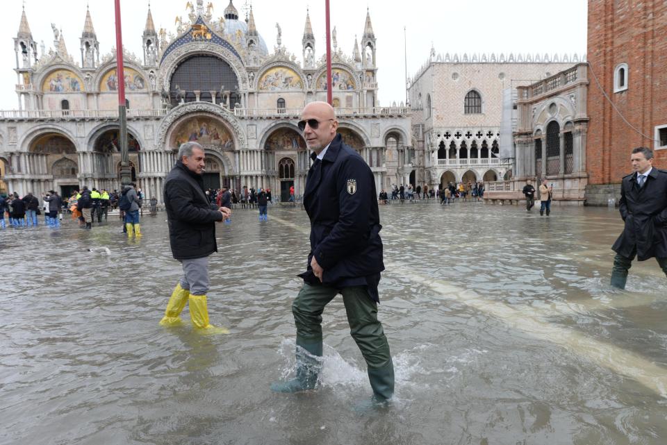 Italy's team manager Gianluca Vialli is seen in St. Mark's Square during a solidarity visit to Venice following the exceptional high water that brought the city to its knees, in Venice, northern Italy, Saturday, Nov. 16, 2019. Four days ago, the Italian lagoon city experienced its worst flooding in more than 50 years. (Andrea Merola/ANSA via AP)