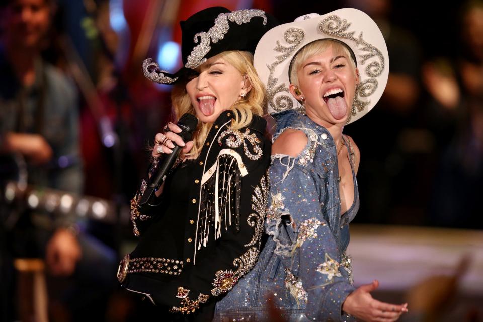 Madonna, left, and Miley Cyrus perform together onstage during "Miley Cyrus: MTV Unplugged" at Sunset Gower Studios in Los Angeles on Jan. 29, 2014