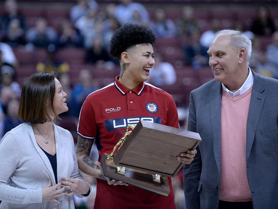 McKinley High School senior Kierstan Bell receives the 2018-19 OPSWA Ohio Ms. Basketball Award from OHSAA Executive Director Jerry Snodgrass and Kathleen Coughlin during the Division I OHSAA state semifinal between GlenOak and Mount Notre Dame at Jerome Schottenstein Center, March 15, 2019.