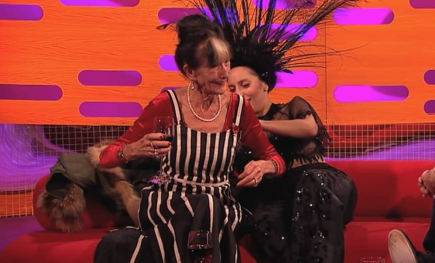 Lady Gaga fixing June Brown's outfit from behind