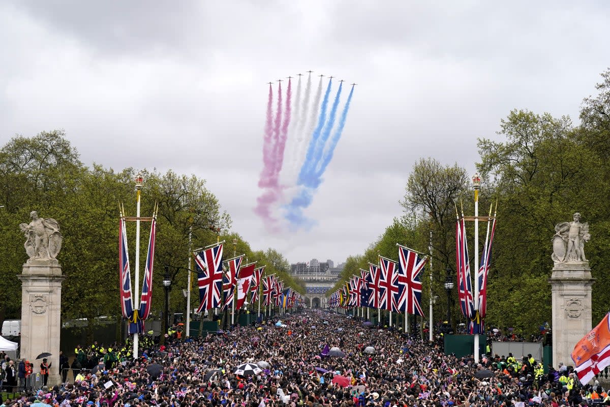 Red Arrows fly over the Mall following the coronation of King Charles III and Queen Camilla (PA Wire)
