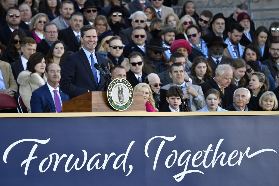 Kentucky Governor Andy Beshear speaks to the audience gathered to witness his public swearing in ceremony on the steps of the Kentucky State Capitol in Frankfort, Ky., Tuesday, Dec. 12, 2023. (AP Photo/Timothy D. Easley)