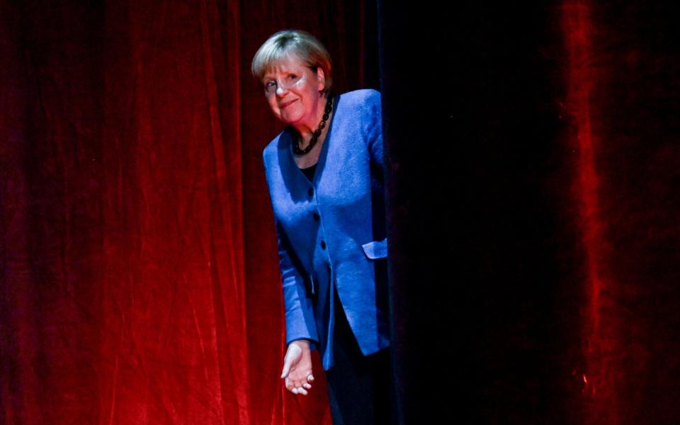 Angela Merkel heads out for an on-stage interview in Berlin - FILIP SINGER/EPA-EFE/Shutterstock