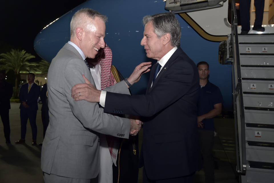 Secretary of State Antony Blinken greets U.S. ambassador to Saudi Arabia Michael Ratney upon his arrival in Jeddah, Saudi Arabia, Tuesday, June 6, 2023. (Amer Hilabi/Pool via AP)