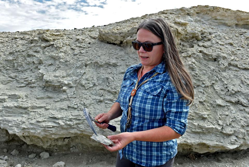 University of Anchorage professor Lee Ann Munk, whose research focuses on geology and geochemistry of lithium deposits, holds a rock from an outcrop in Clayton Valley.