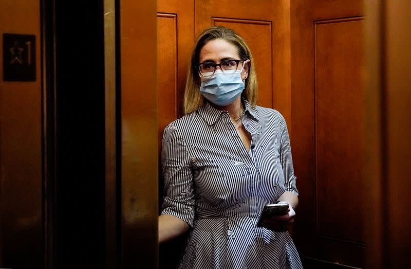 U.S. Senators Manchin and Sinema depart after meeting with White House officials on Capitol Hill in Washington