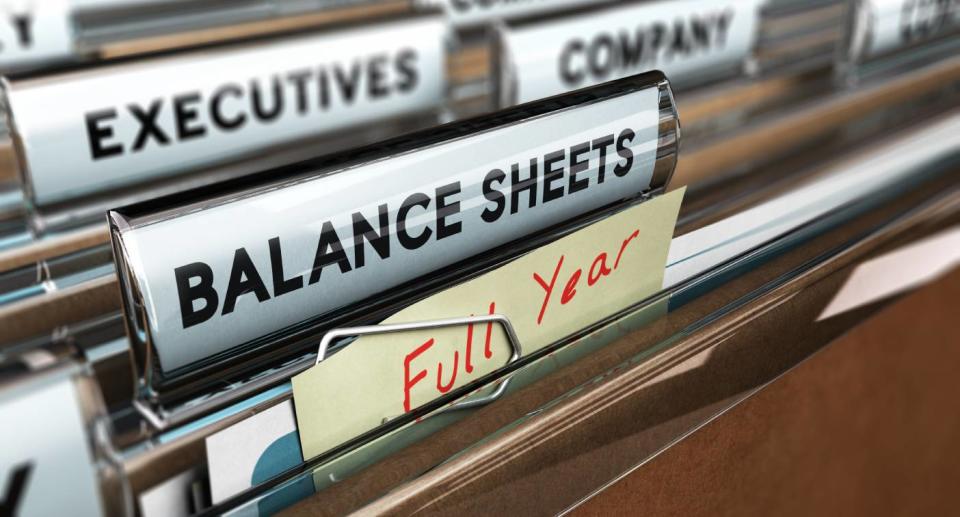 Up-close shot of a filing cabinet showing financial paperwork tags.