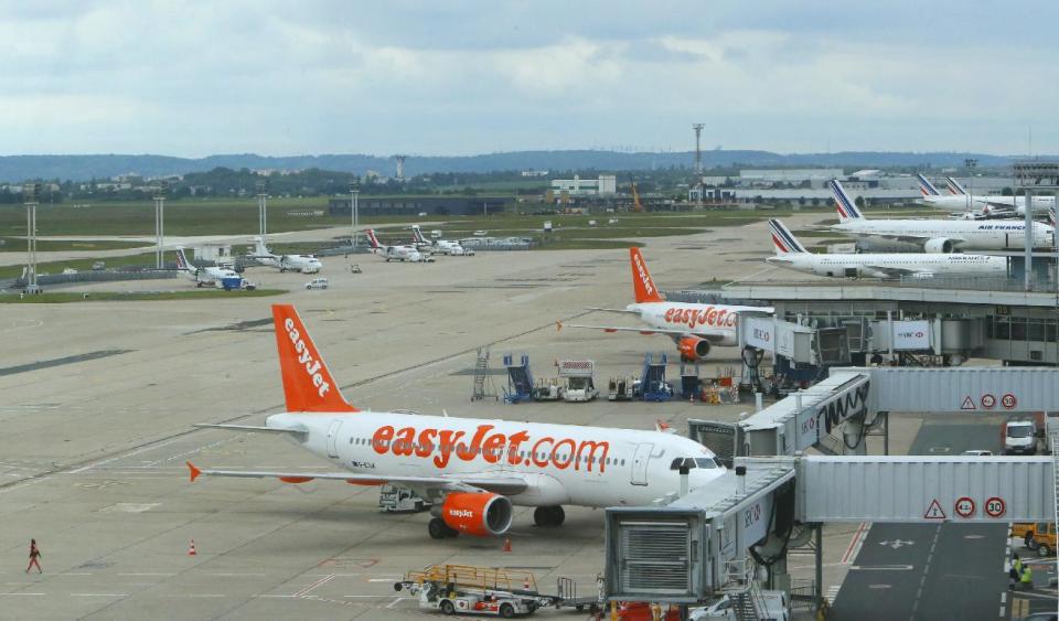 Easyjet and Air France planes stand idle on the tarmac of Orly airport, west of Paris, France, during an air traffic controllers strike, Tuesday, June 11, 2013. Airlines have slashed flights in France as a strike by air traffic controllers fearful of a plan to unify European skies went into full force Tuesday. France's main airports have cut their flight timetables in half to cope with a three-day strike by air traffic controllers.(AP Photo/Jacques Brinon)