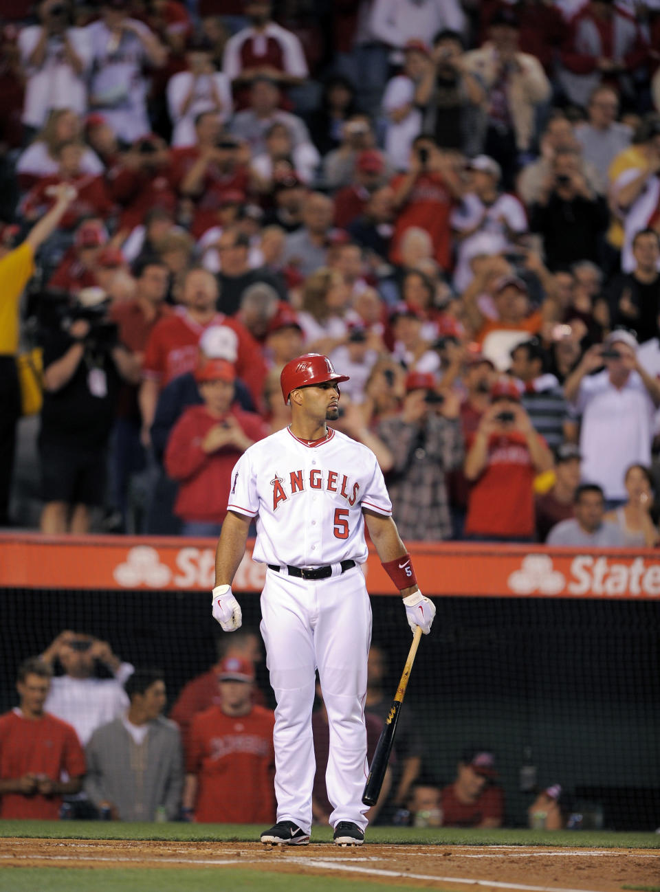 Los Angeles Angels' Albert Pujols gets set to bat during the first inning of a baseball game against the Kansas City Royals, Friday, April 6, 2012, in Anaheim, Calif. (AP Photo/Mark J. Terrill)