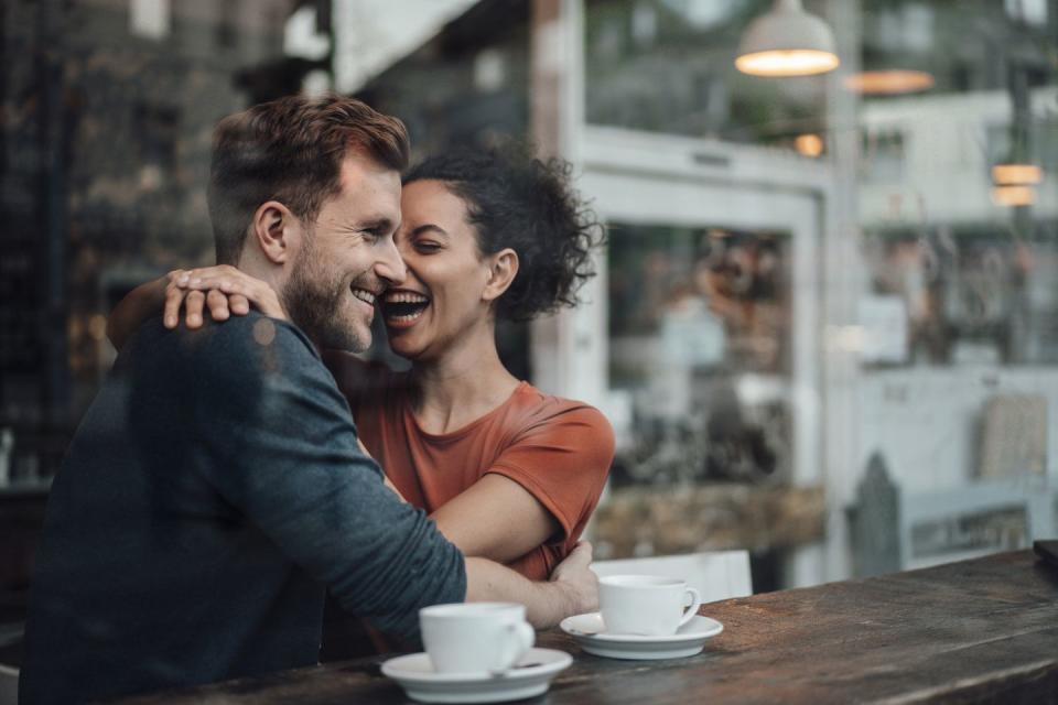 a man and woman kissing