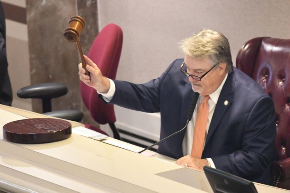 A man wielding a gavel