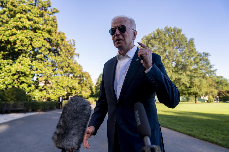 President Joe Biden speaks to members of the media as he arrives at the White House in Washington, Sunday, Sept. 26, 2021, after returning from a weekend at Camp David. (AP Photo/Andrew Harnik)