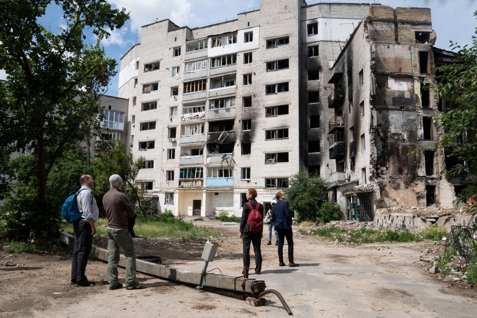 Investigator examine the destruction from the Russian invasion in Borodyanka, Ukraine.