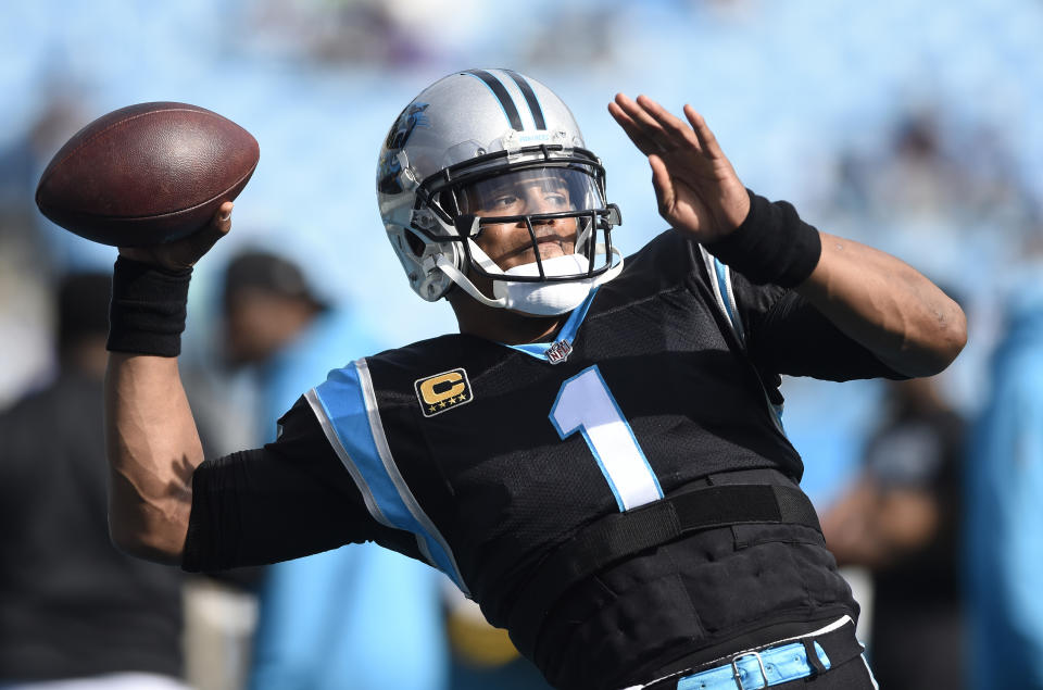 Carolina Panthers' Cam Newton (1) warms up before an NFL football game against the Seattle Seahawks in Charlotte, N.C., Sunday, Nov. 25, 2018. (AP Photo/Mike McCarn)