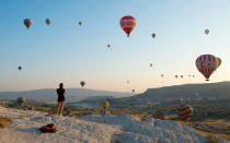 <p>If you’re wanting to re-experience your time in the air (or hoping to get a sneak preview), head to Göreme's <a rel="nofollow noopener" href="https://www.tripadvisor.com/Attraction_Review-g297983-d10005745-Reviews-Sunset_Point-Goreme_Cappadocia.html" target="_blank" data-ylk="slk:Sunset Point;elm:context_link;itc:0;sec:content-canvas" class="link ">Sunset Point</a> early in the morning to watch the balloons rise with the sun.</p>