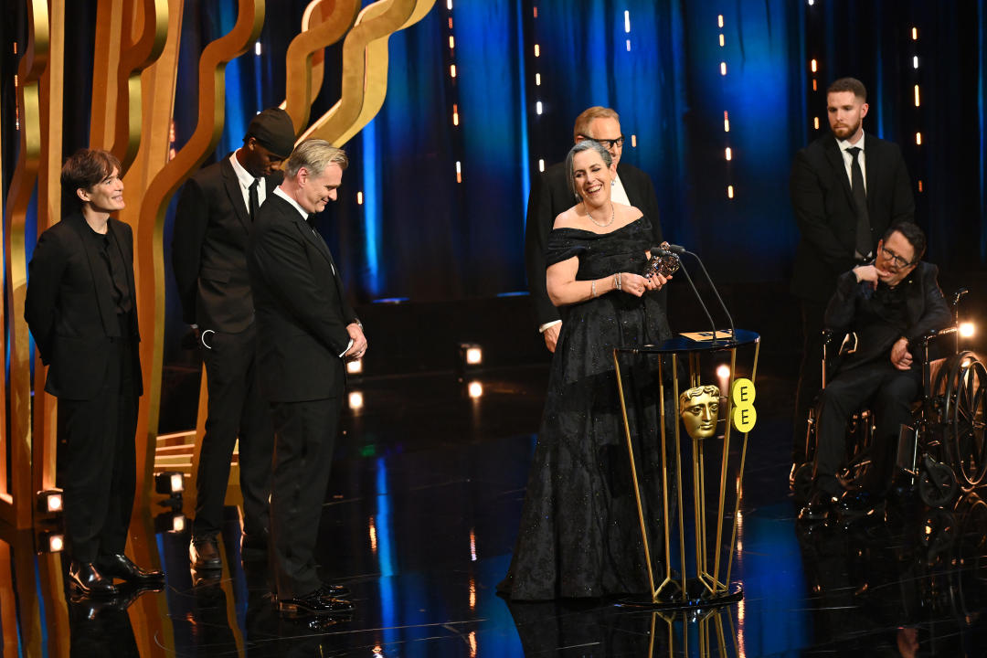 LONDON, ENGLAND - FEBRUARY 18: Cillian Murphy, Christopher Nolan, Charles Roven and Emma Thomas accept the Best Film Award for 'Oppenheimer' on stage during the EE BAFTA Film Awards 2024 at The Royal Festival Hall on February 18, 2024 in London, England. (Photo by Joe Maher/BAFTA/Getty Images for BAFTA)