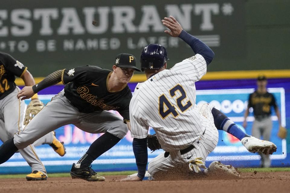 Pittsburgh Pirates' Kevin Newman tags out Milwaukee Brewers' Avisail Garcia as he tries to steal second during the sixth inning of a baseball game Friday, April 16, 2021, in Milwaukee. (AP Photo/Morry Gash)