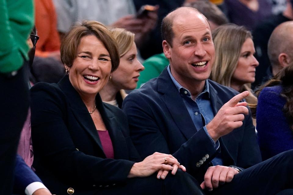 Britain's Prince William jokes with Massachusetts Gov.-elect Maura Healey during the first half of an NBA basketball game between the Miami Heat and the Boston Celtics on Wednesday, Nov. 30, 2022, in Boston. (AP Photo/Charles Krupa)