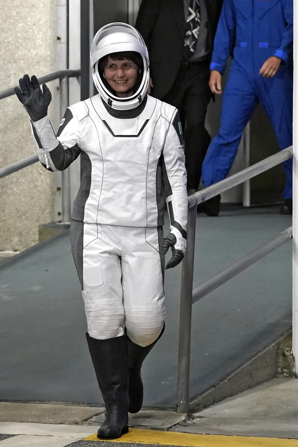 European Space Agency astronaut Samantha Cristoforetti, of Italy, waves as she leaves the Operations and Checkout Building Wednesday, April 27, 2022, at the Kennedy Space Center in Cape Canaveral, Fla. Four astronauts will fly on SpaceX's Crew-4 mission to the International Space Station. (AP Photo/John Raoux)