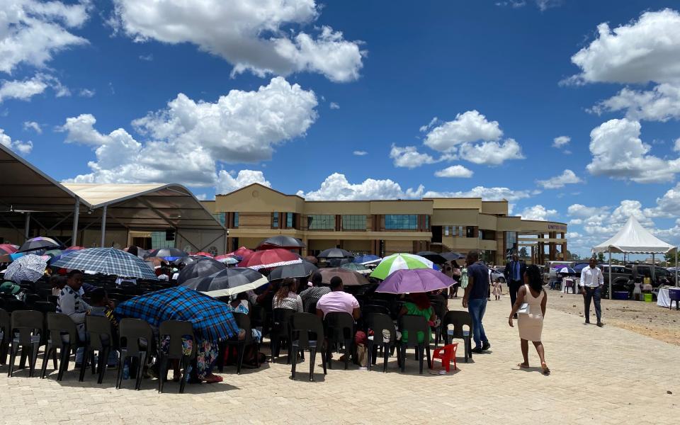 Less fortunate worshippers enjoy the service from outside the church