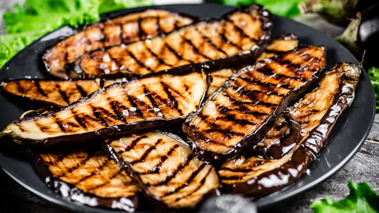 Grilled eggplant slices on platter